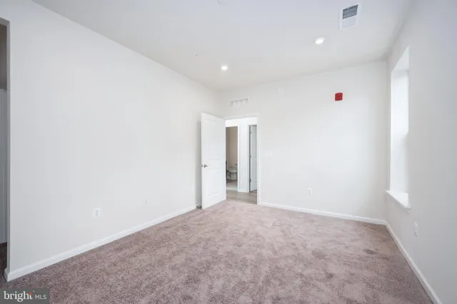 a bathroom with a shower and a sink
