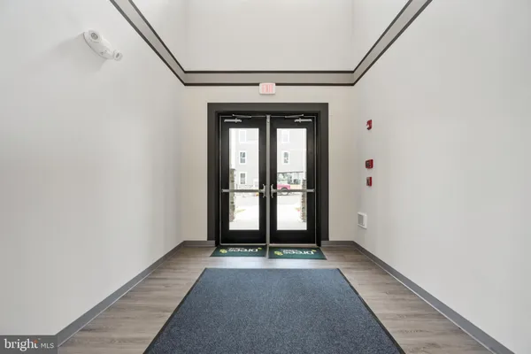 a view of entryway with wooden floor