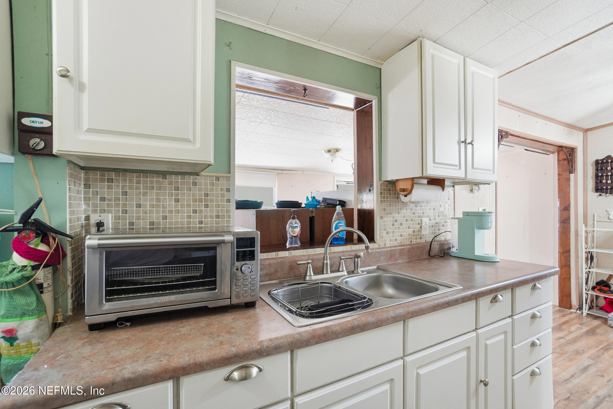 43 Forrestal Circle North Atlantic Beach, FL 32233 - Photo 12 of 39 a kitchen with a sink cabinets and a stove