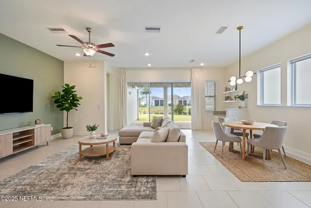 a view of an empty room with a kitchen