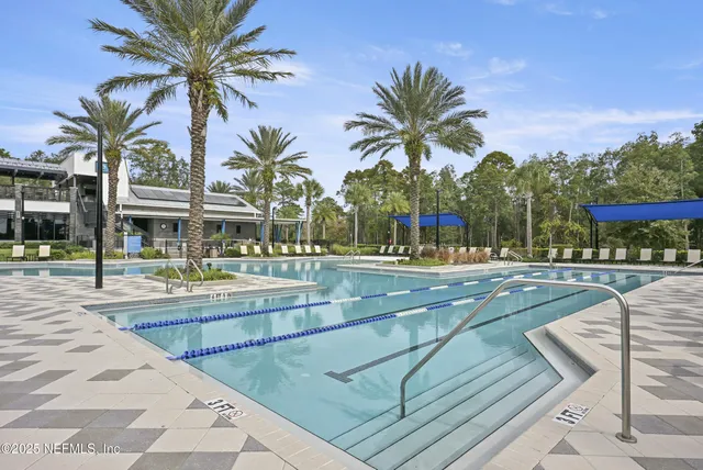 a view of a swimming pool with a lounge chair