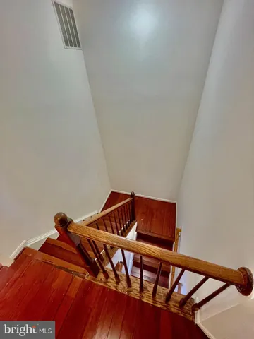 a view of a hallway with stairs