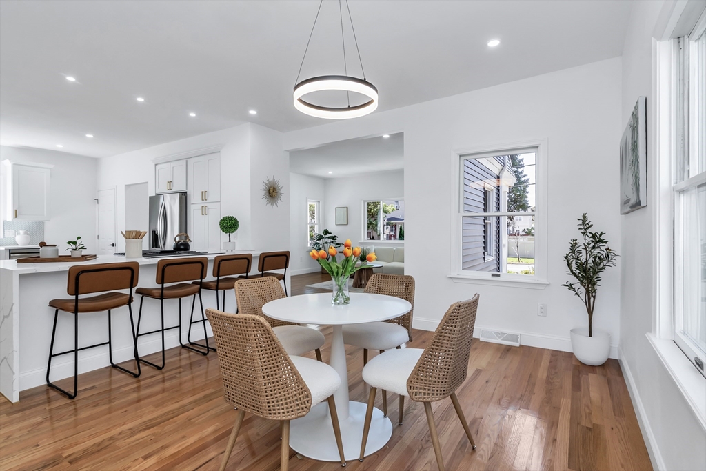 24 Ballard Street Saugus, MA 01906 - Photo 12 of 38 a view of a dining room with furniture and wooden floor
