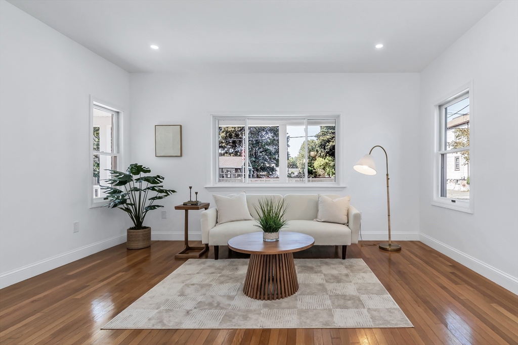 24 Ballard Street Saugus, MA 01906 - Photo 15 of 38 a living room with furniture a window and a potted plant