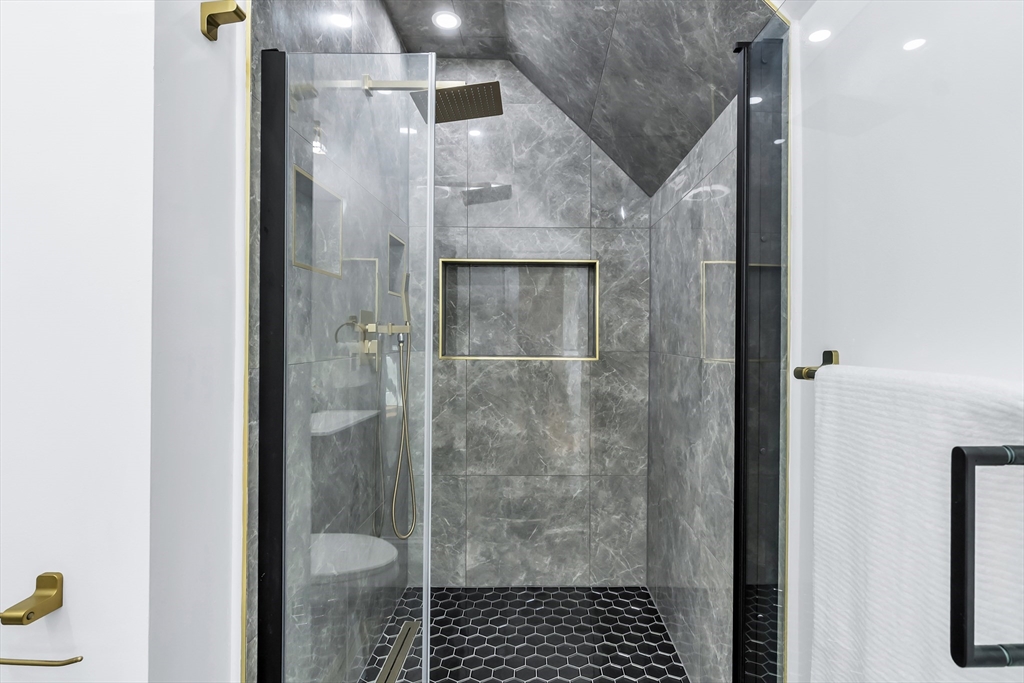 24 Ballard Street Saugus, MA 01906 - Photo 22 of 38 a bathroom with a shower and toilet