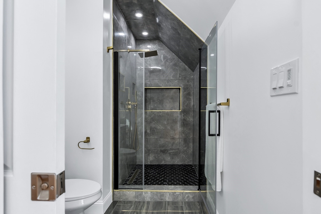 24 Ballard Street Saugus, MA 01906 - Photo 25 of 38 a bathroom with a shower and toilet