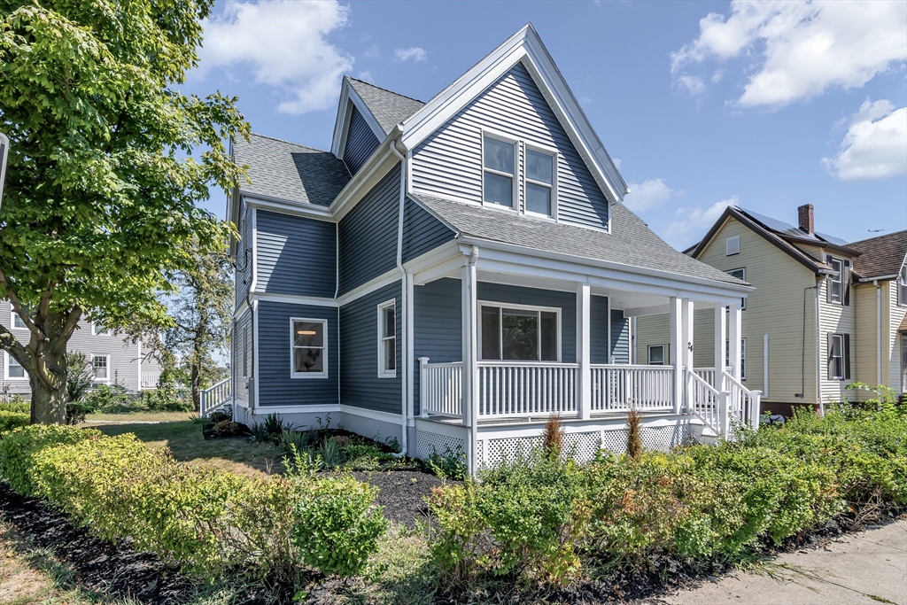 24 Ballard Street Saugus, MA 01906 - Photo 36 of 38 a front view of a house with a yard