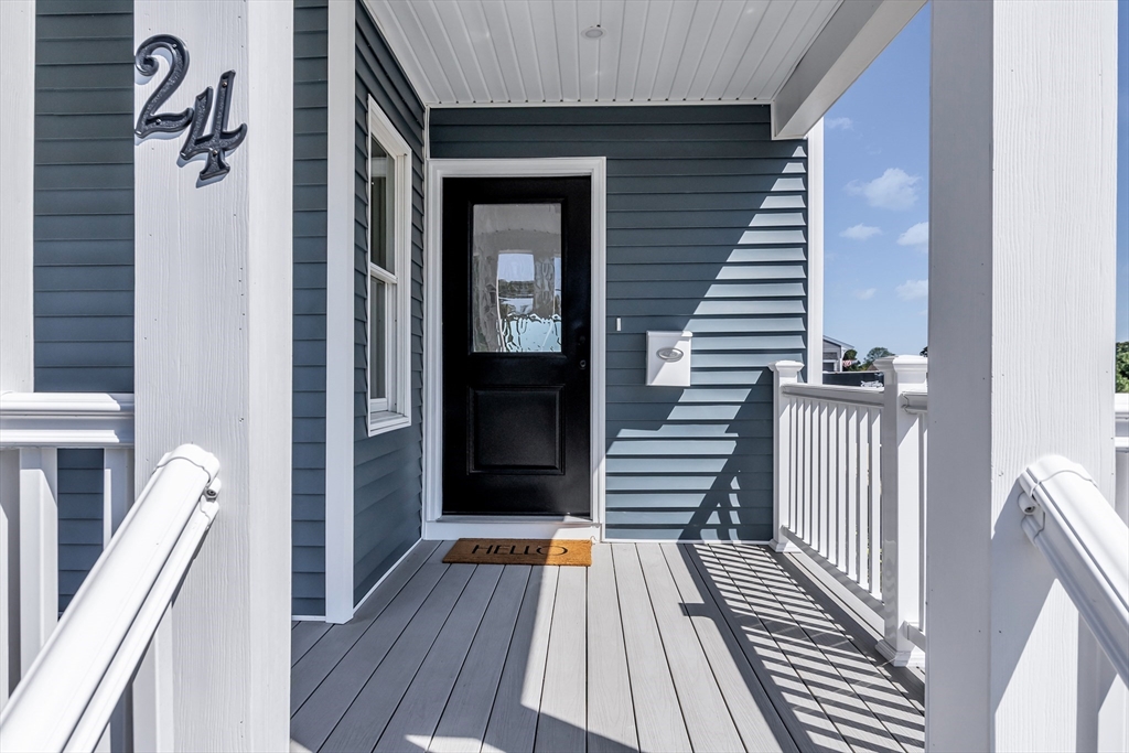 24 Ballard Street Saugus, MA 01906 - Photo 37 of 38 a view of a hallway with wooden floor and staircase