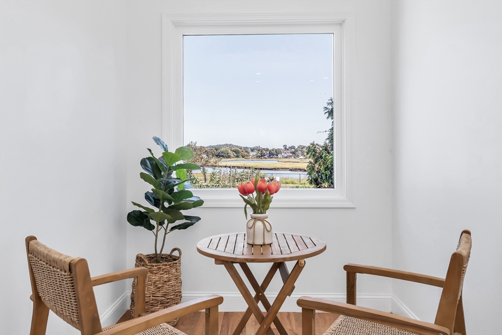 24 Ballard Street Saugus, MA 01906 - Photo 5 of 38 a view of a dining room with furniture a potted plant and wooden floor