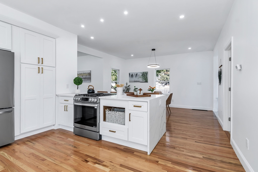 24 Ballard Street Saugus, MA 01906 - Photo 9 of 38 a kitchen with stainless steel appliances a white stove top oven and refrigerator