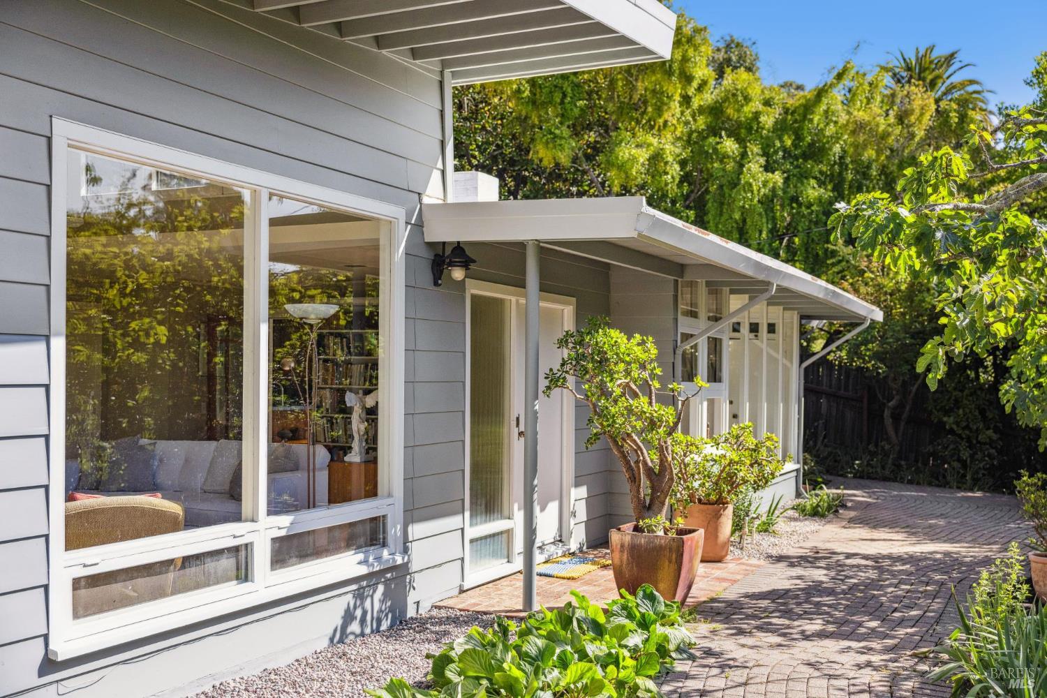 a front view of a house with a glass door