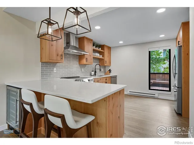 a kitchen with a table and chairs