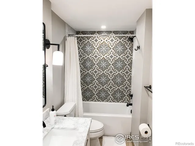 a bathroom with a bathtub and shower