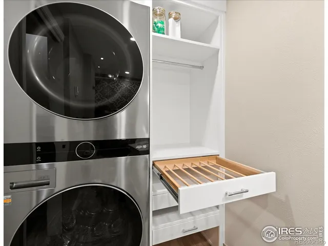 a living room with a washer and dryer