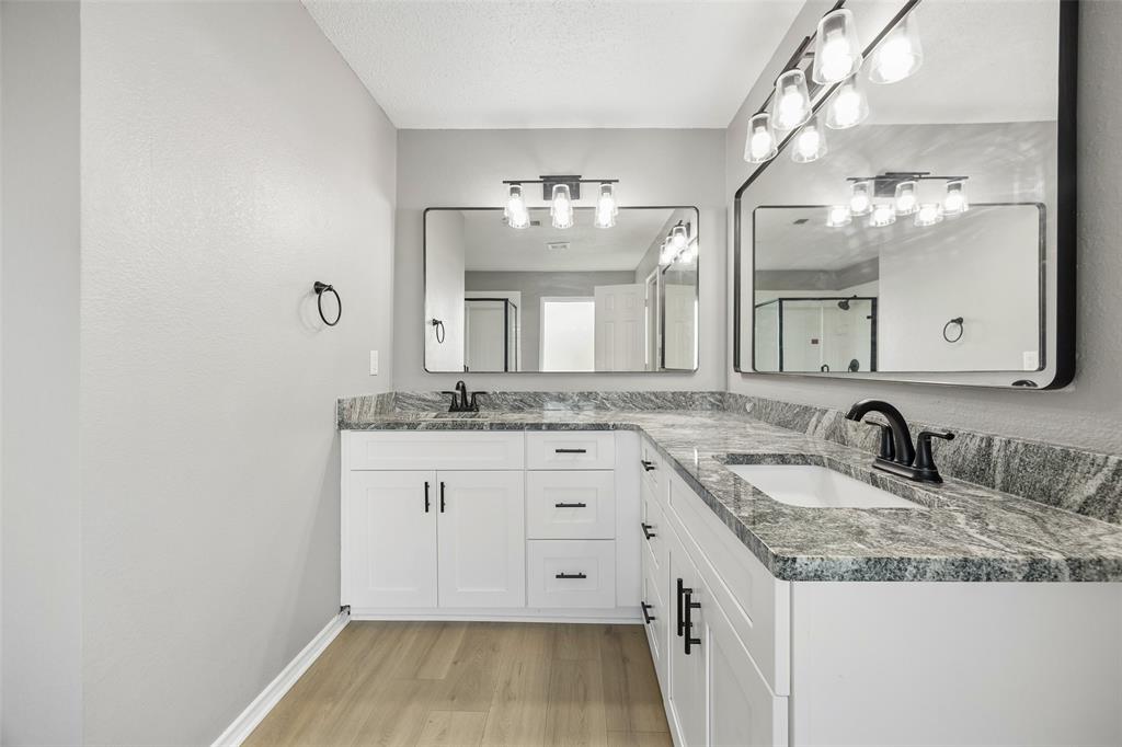 753 Summerfield Drive Allen, TX 75002 - Photo 23 of 40 Dual vanity with white cabinetry and dark hardware