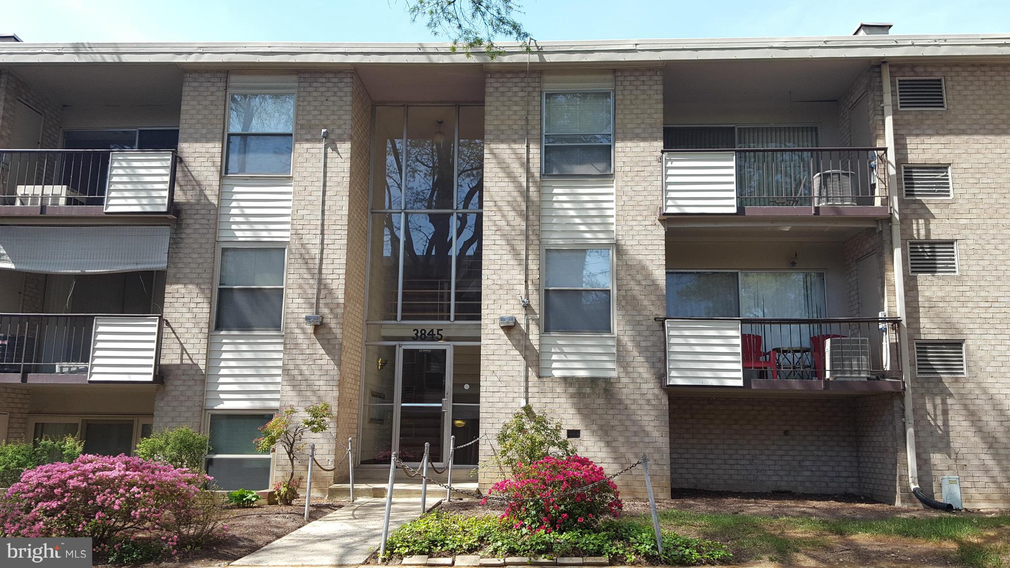 3845 St Barnabas Road, Unit T Suitland, MD 20746 - Photo 1 of 8 a front view of a house with plants