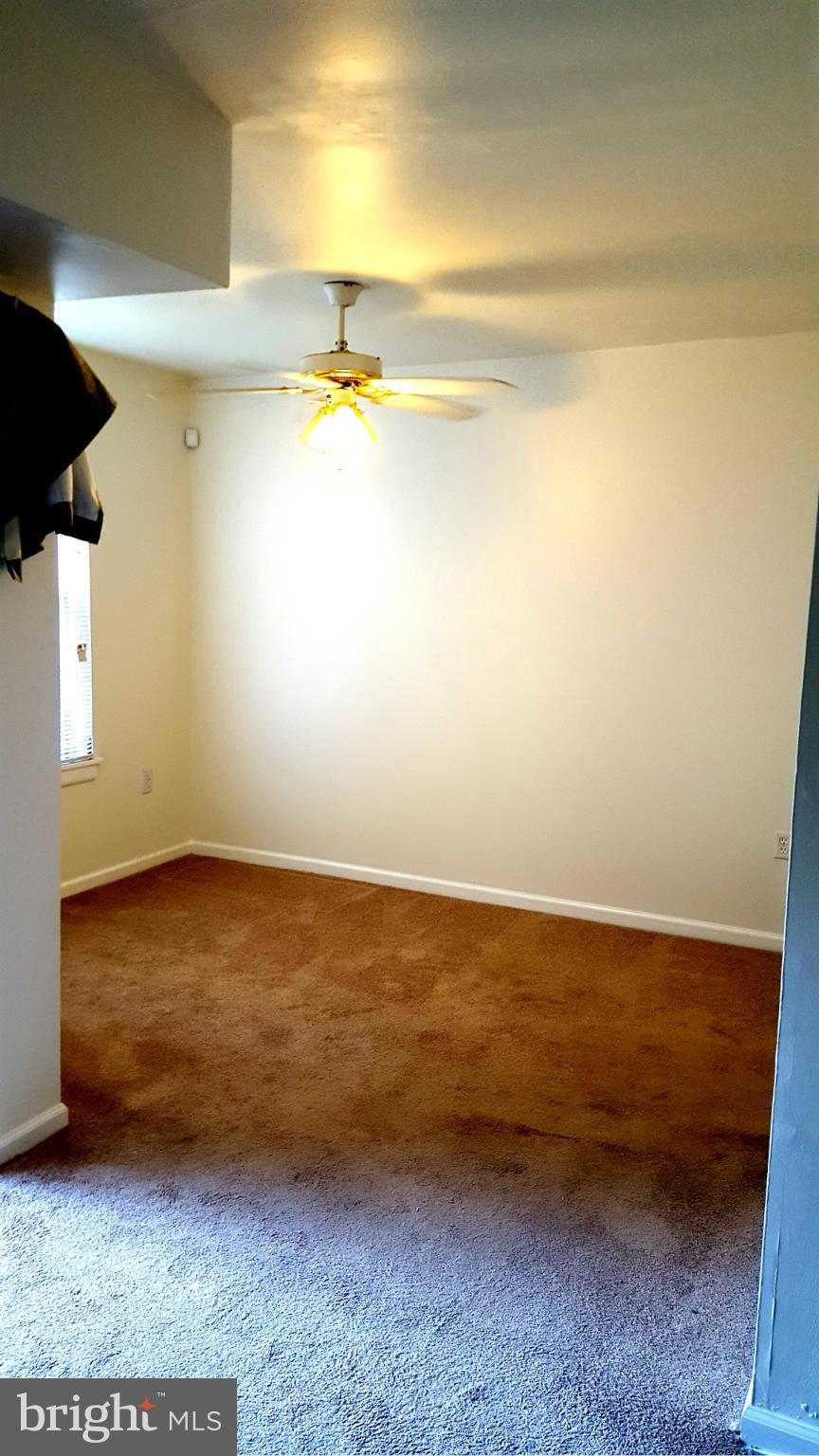 3845 St Barnabas Road, Unit T Suitland, MD 20746 - Photo 7 of 8 a view of an empty room and window