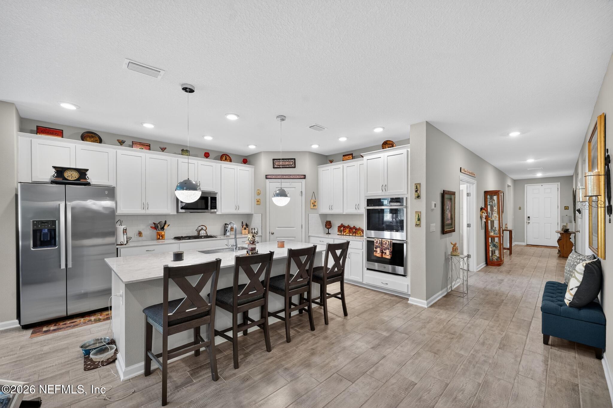 75505 Banyan Way Yulee, FL 32097 - Photo 11 of 30 a large kitchen with a table and chairs