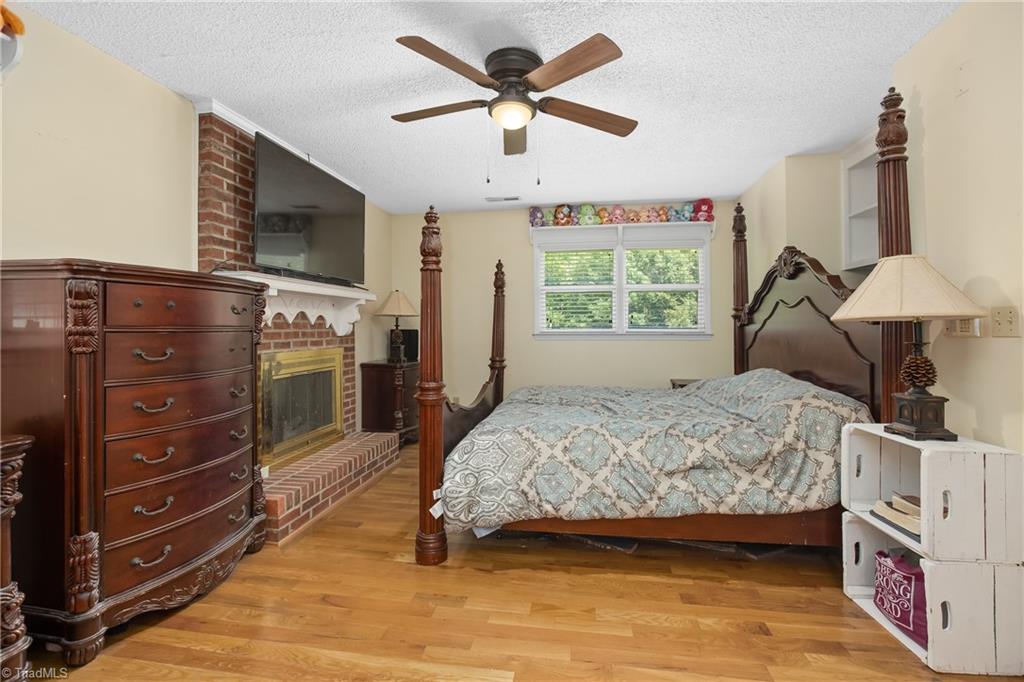 475 Farmstead Road Winston-Salem, NC 27107 - Photo 7 of 33 Large primary bedroom with fire place!