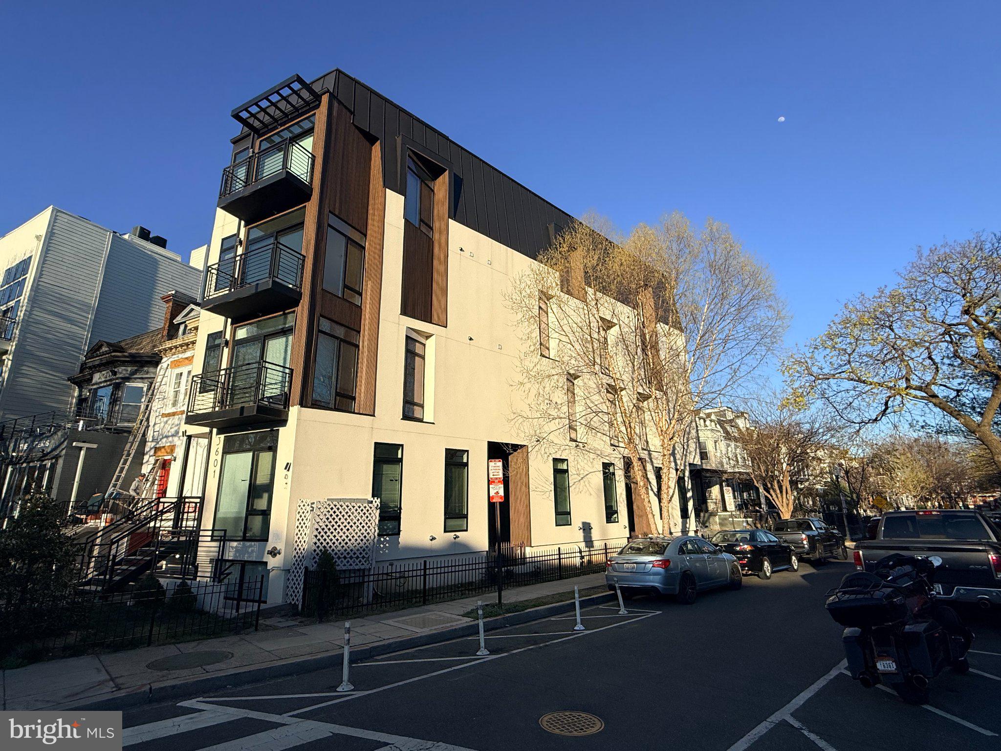 3601 14th Street Northwest, Unit 6 Washington, DC 20010 - Photo 1 of 26 a city street lined with tall buildings