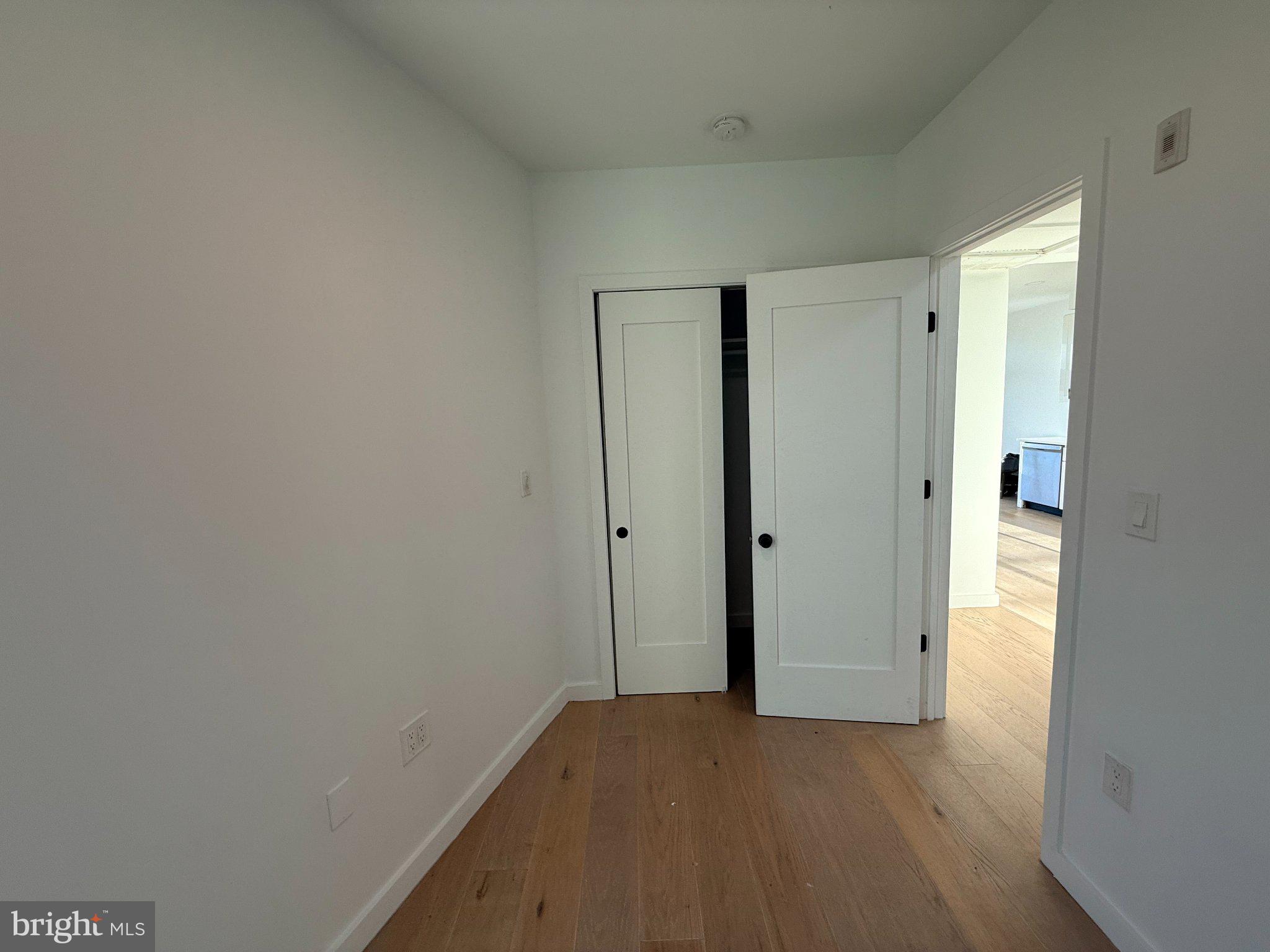 3601 14th Street Northwest, Unit 6 Washington, DC 20010 - Photo 11 of 26 a view of a room with an empty space and wooden floor