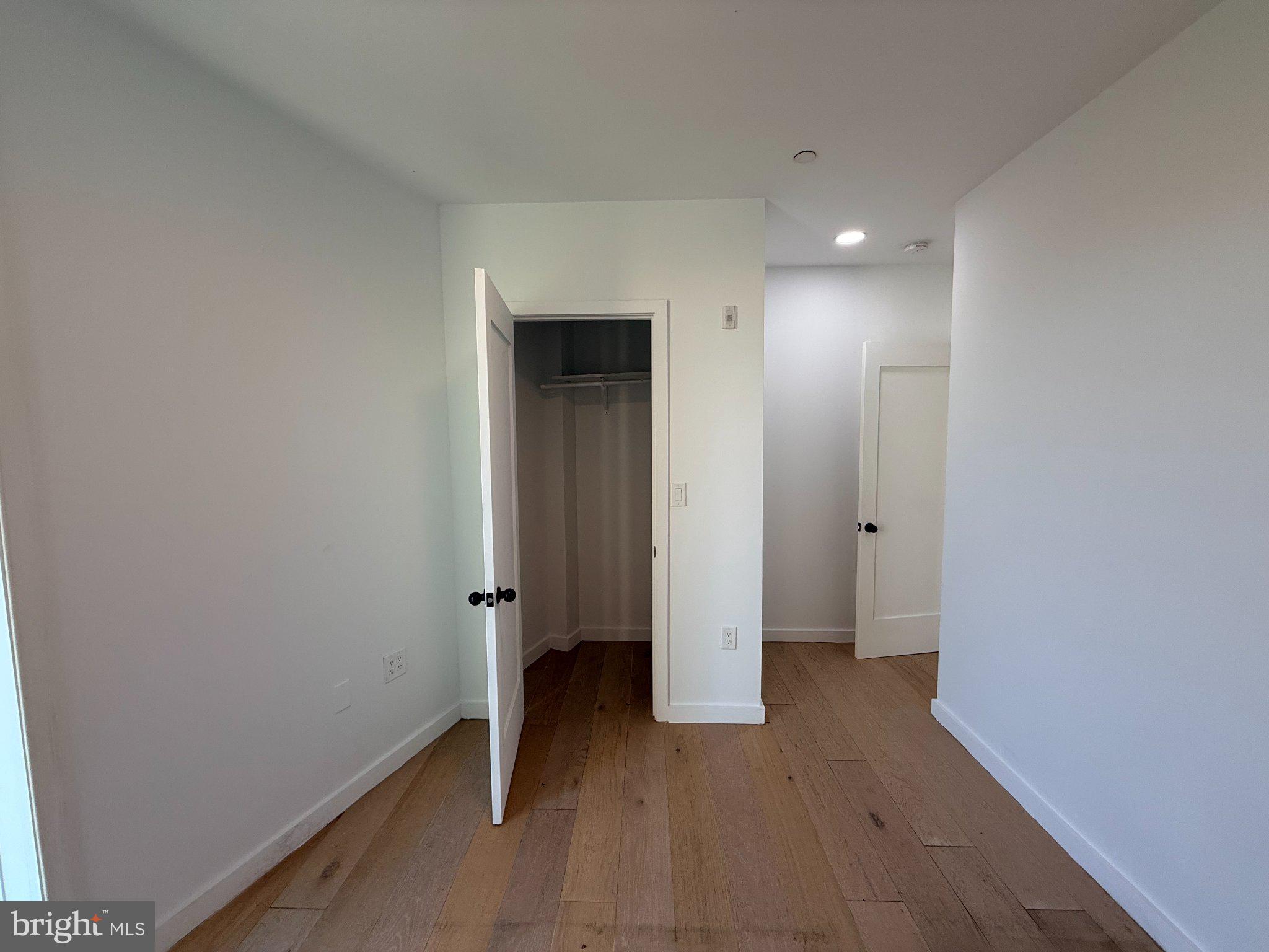 3601 14th Street Northwest, Unit 6 Washington, DC 20010 - Photo 14 of 26 an empty room with wooden floor and closet