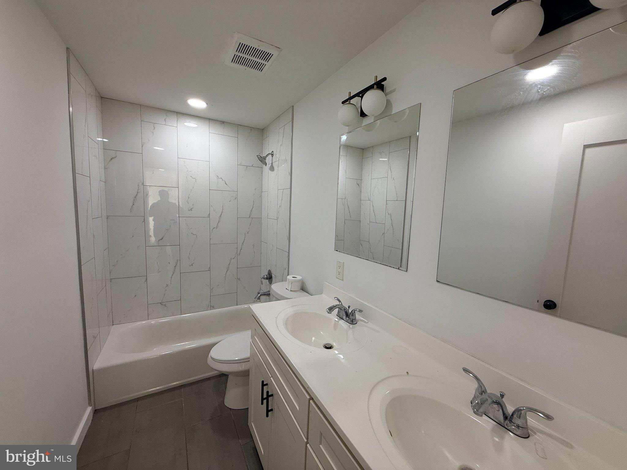 3601 14th Street Northwest, Unit 6 Washington, DC 20010 - Photo 16 of 26 a bathroom with a bathtub shower sink and toilet