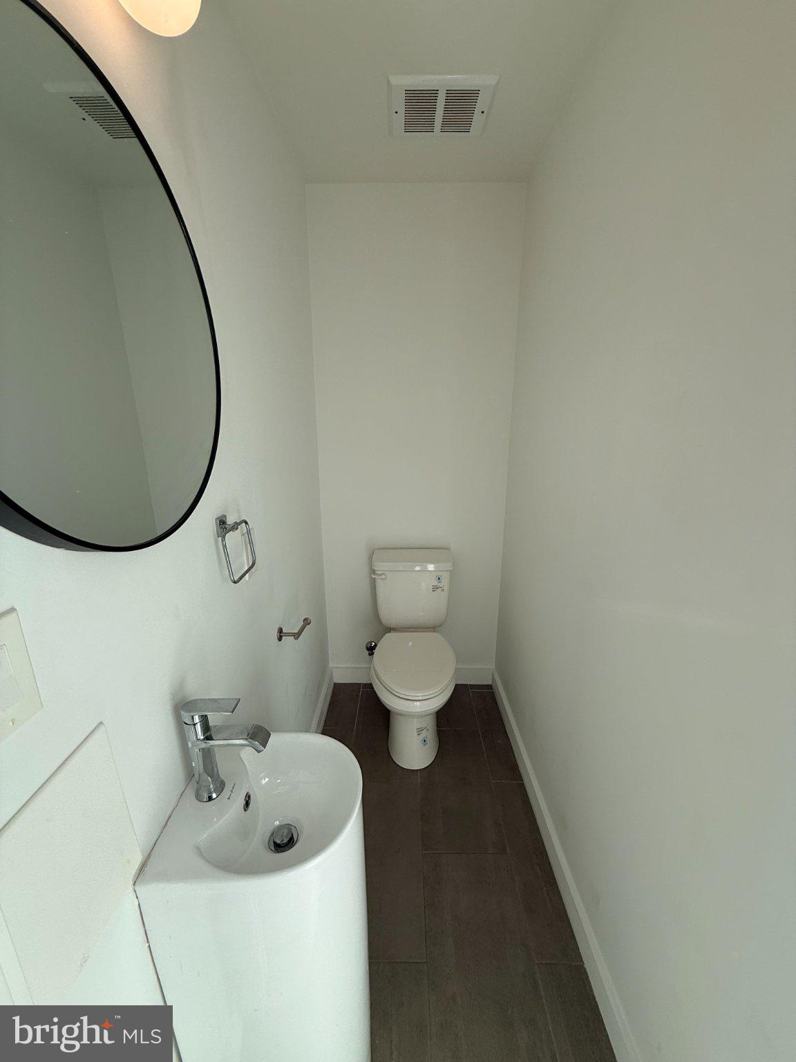 3601 14th Street Northwest, Unit 6 Washington, DC 20010 - Photo 9 of 26 a bathroom with a toilet and a sink