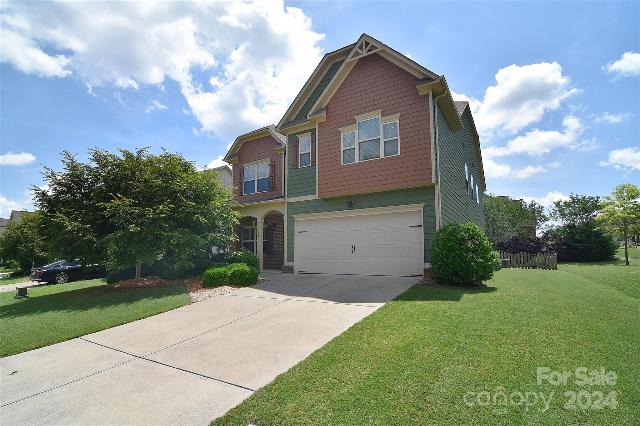 7004 Sedgewick Road Indian Trail, NC 28079 - Photo 1 of 38 a front view of a house with a yard
