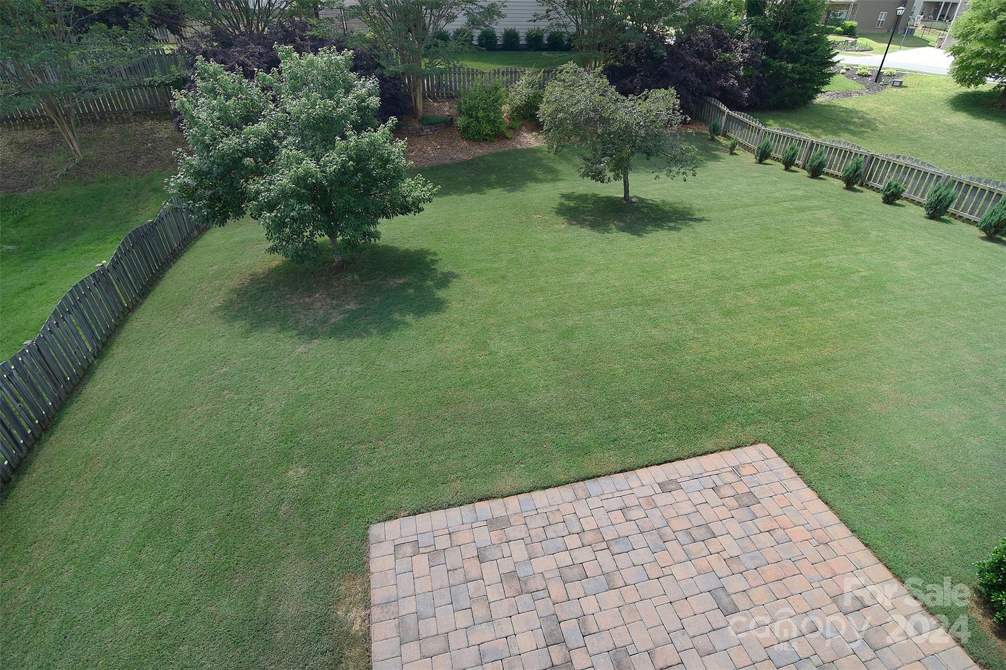 7004 Sedgewick Road Indian Trail, NC 28079 - Photo 21 of 38 a view of a garden with a bench