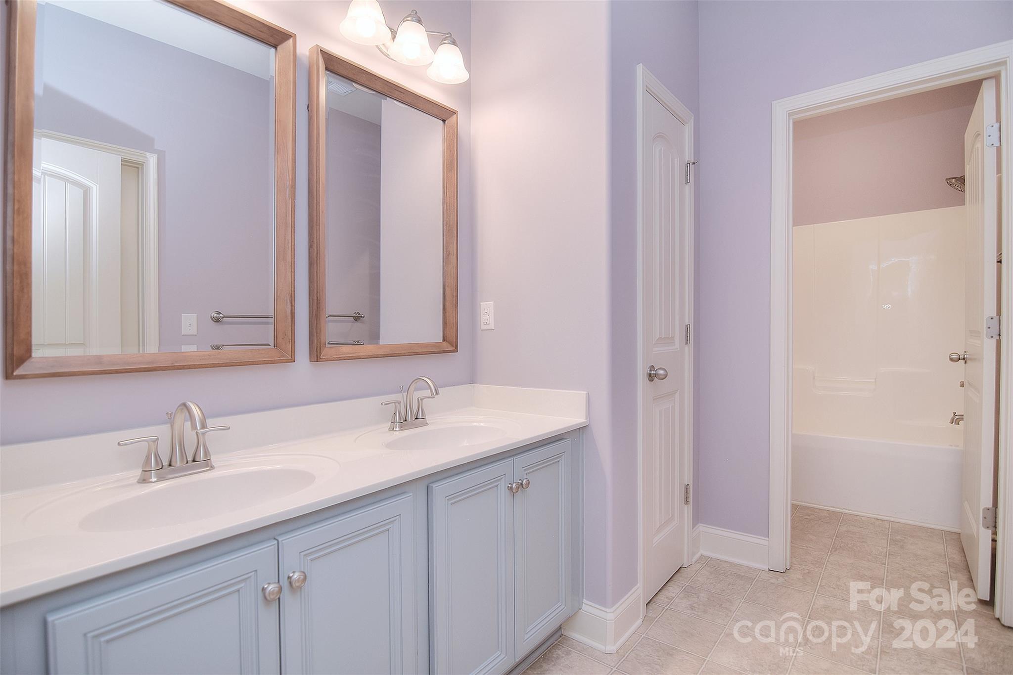7004 Sedgewick Road Indian Trail, NC 28079 - Photo 24 of 38 a bathroom with a sink and a mirror