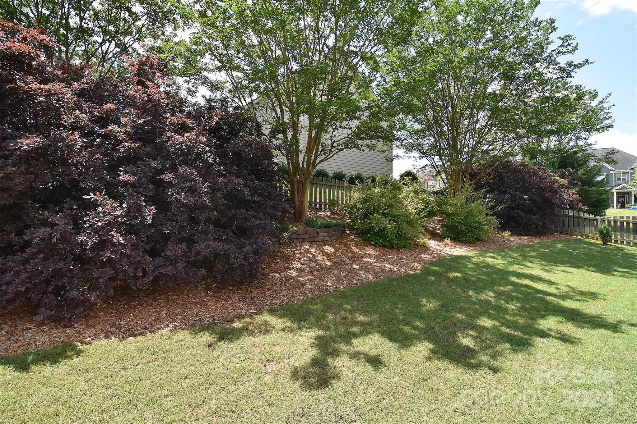 7004 Sedgewick Road Indian Trail, NC 28079 - Photo 33 of 38 a backyard of a house with lots of green space