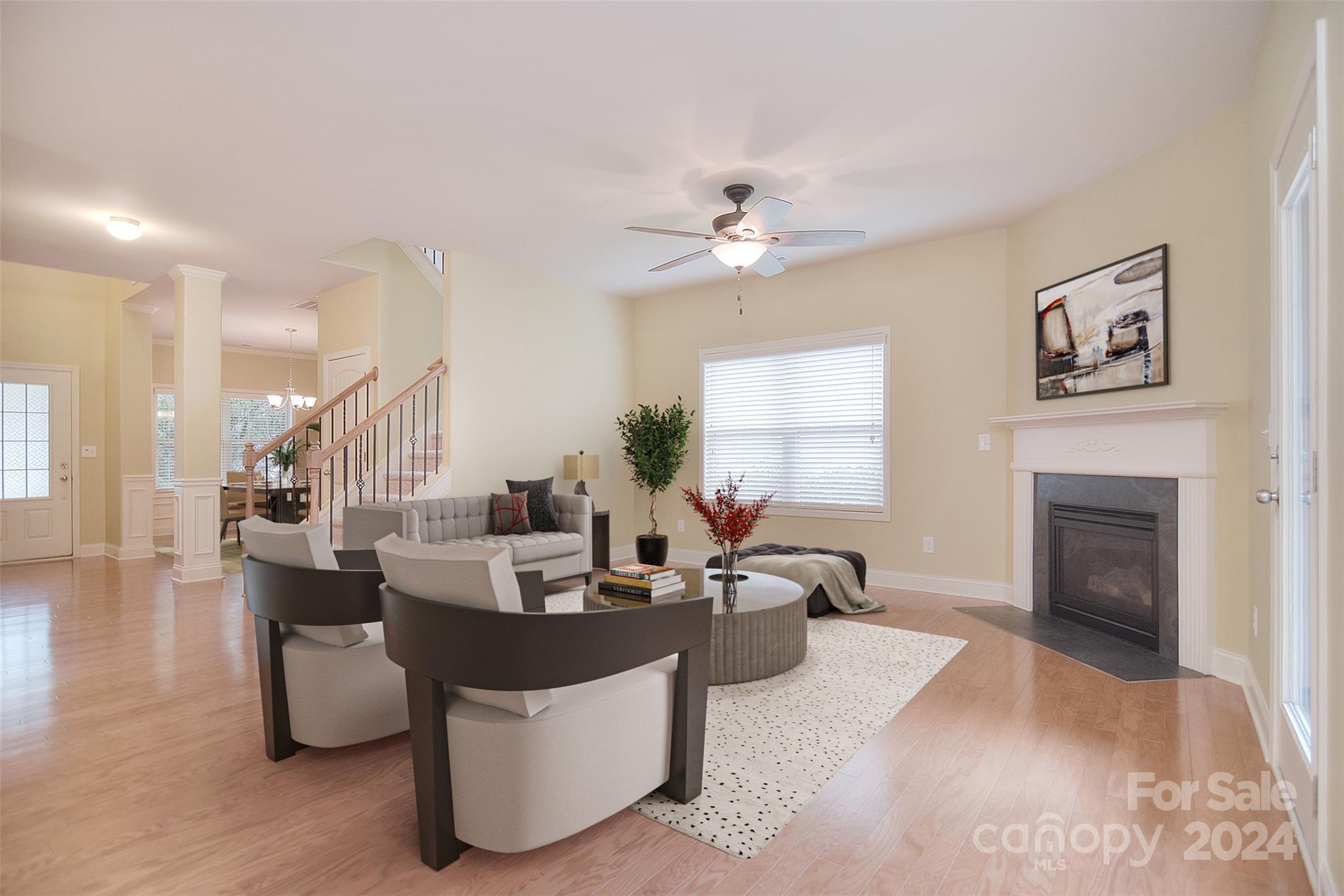 7004 Sedgewick Road Indian Trail, NC 28079 - Photo 6 of 38 a living room with fireplace furniture and a chandelier