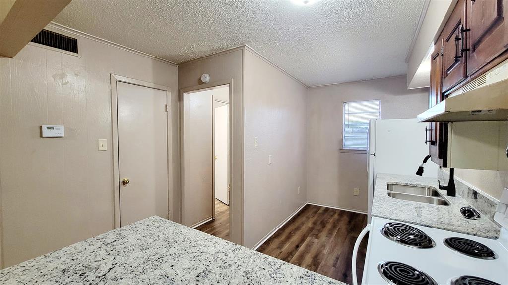 400 Bill Bradford, Unit 13 Sulphur Springs, TX 75482 - Photo 5 of 10 a bedroom with a bed and a dresser