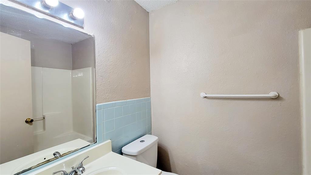 400 Bill Bradford, Unit 13 Sulphur Springs, TX 75482 - Photo 10 of 10 a bathroom with a toilet and a shower