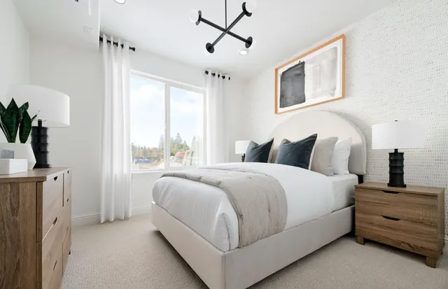 a bedroom with bed and window