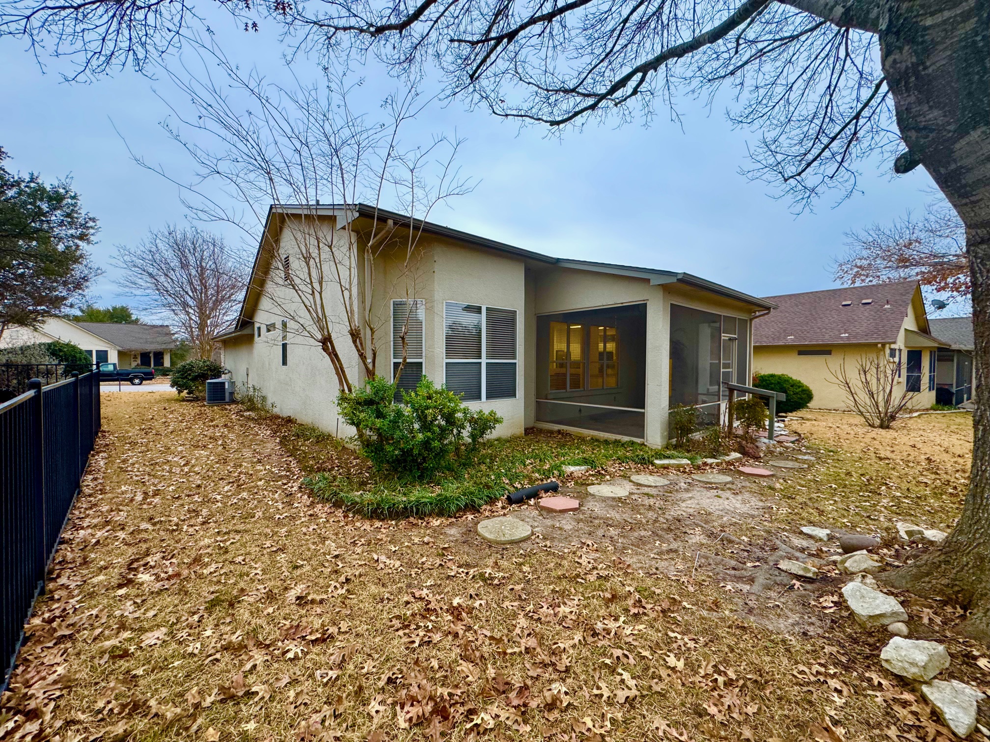 262 Whispering Wind Drive Georgetown, TX 78633 - Photo 20 of 20 View of home's exterior with stucco siding and a sunroom