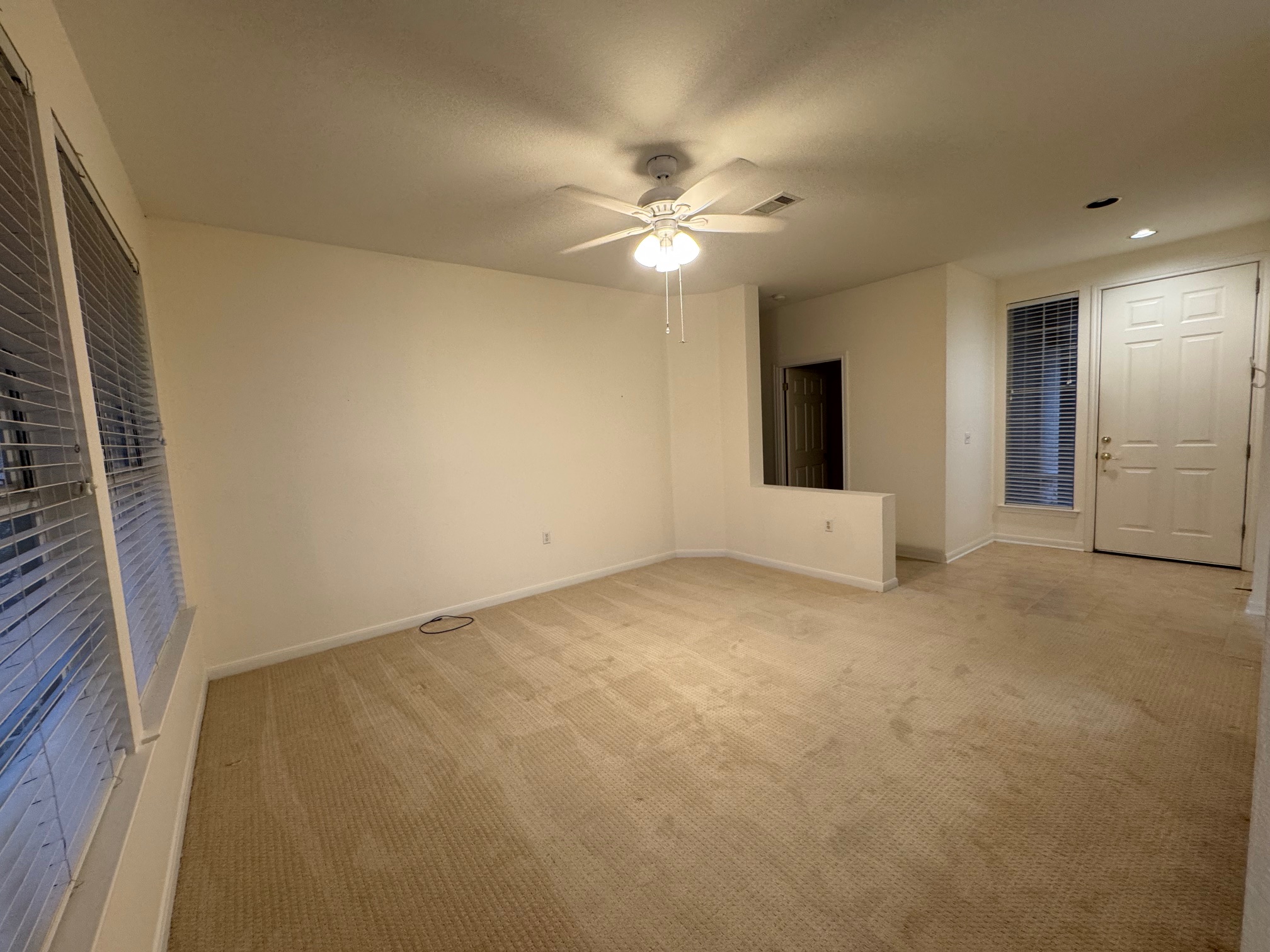 262 Whispering Wind Drive Georgetown, TX 78633 - Photo 4 of 20 Spare room with light carpet, ceiling fan, and recessed lighting