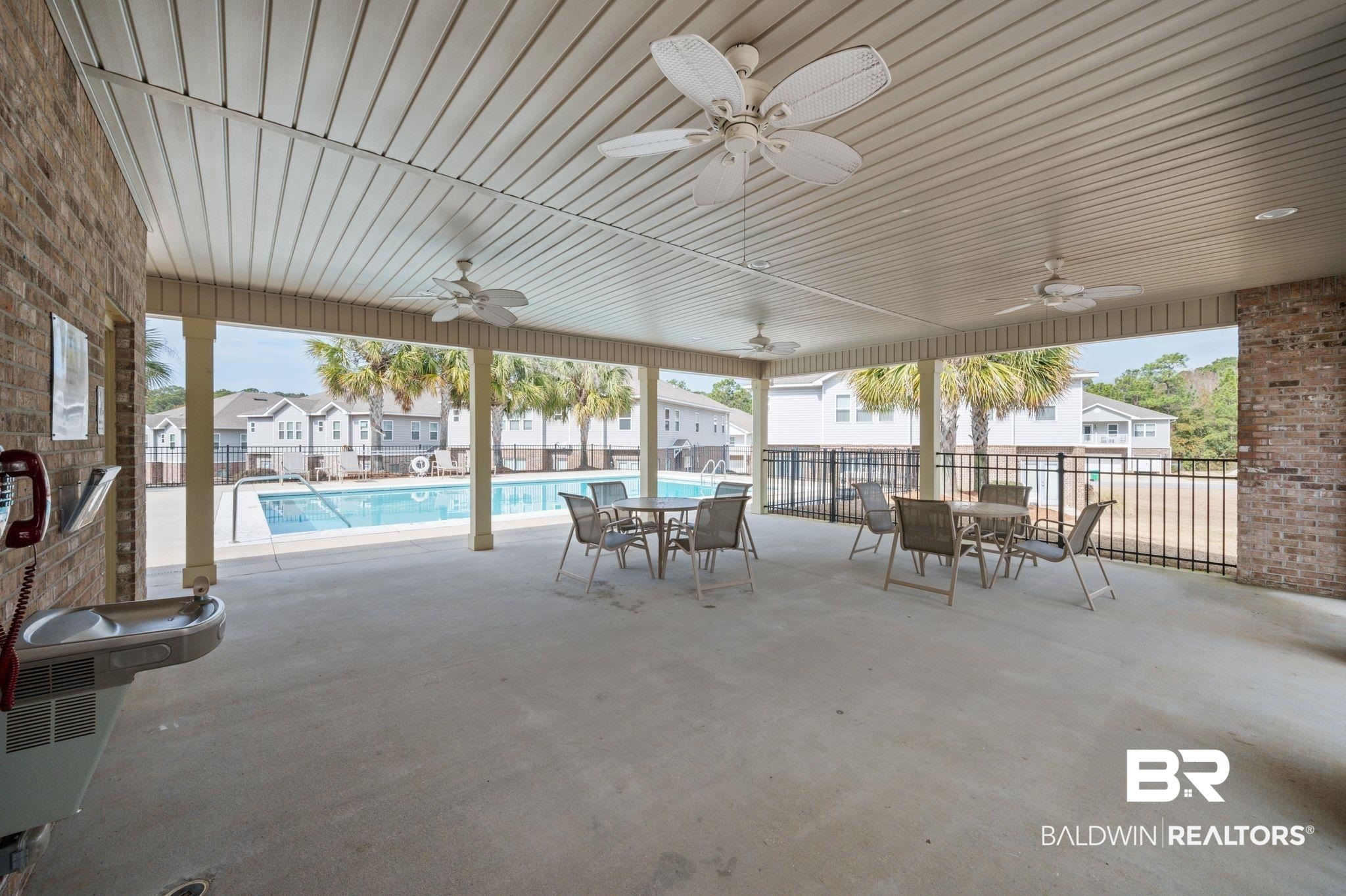 6903 Spaniel Drive, Unit B Spanish Fort, AL 36527 - Photo 24 of 28 View of patio / terrace featuring ceiling fan, fence, and a community pool