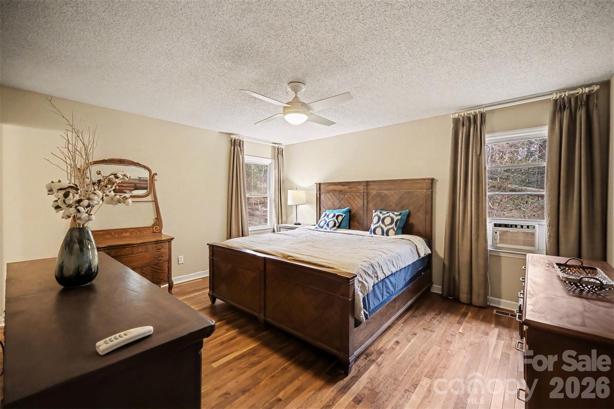 16421 Shallow Pond Road Charlotte, NC 28278 - Photo 11 of 24 a bedroom with a bed and a chandelier