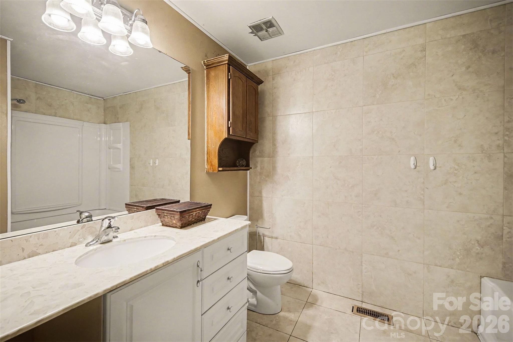 16421 Shallow Pond Road Charlotte, NC 28278 - Photo 12 of 24 a bathroom with a granite countertop sink toilet and shower