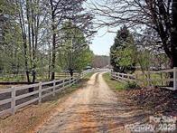 16421 Shallow Pond Road Charlotte, NC 28278 - Photo 16 of 24 a view of a yard with wooden fence