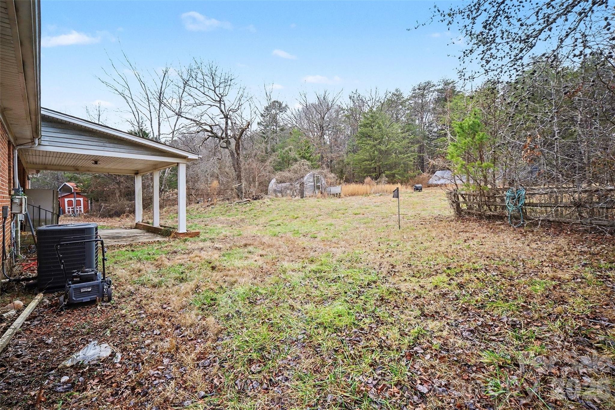 16421 Shallow Pond Road Charlotte, NC 28278 - Photo 17 of 24 a view of a yard with wooden house