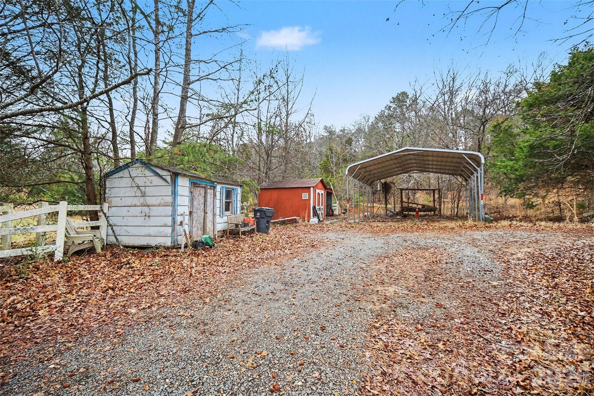 16421 Shallow Pond Road Charlotte, NC 28278 - Photo 18 of 24 a backyard of a house with table and chairs