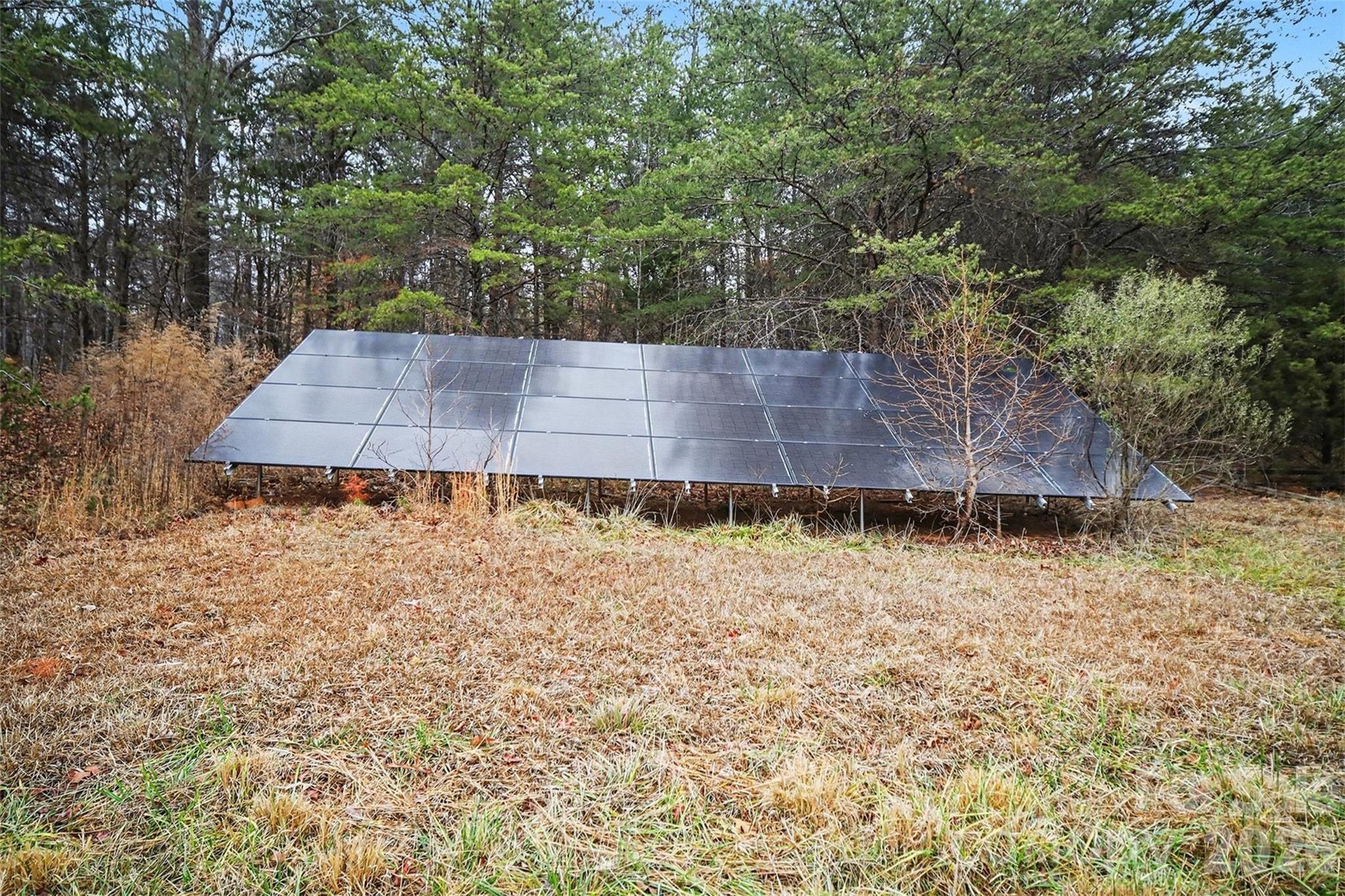 16421 Shallow Pond Road Charlotte, NC 28278 - Photo 19 of 24 a wooden bench sitting in a backyard of a house