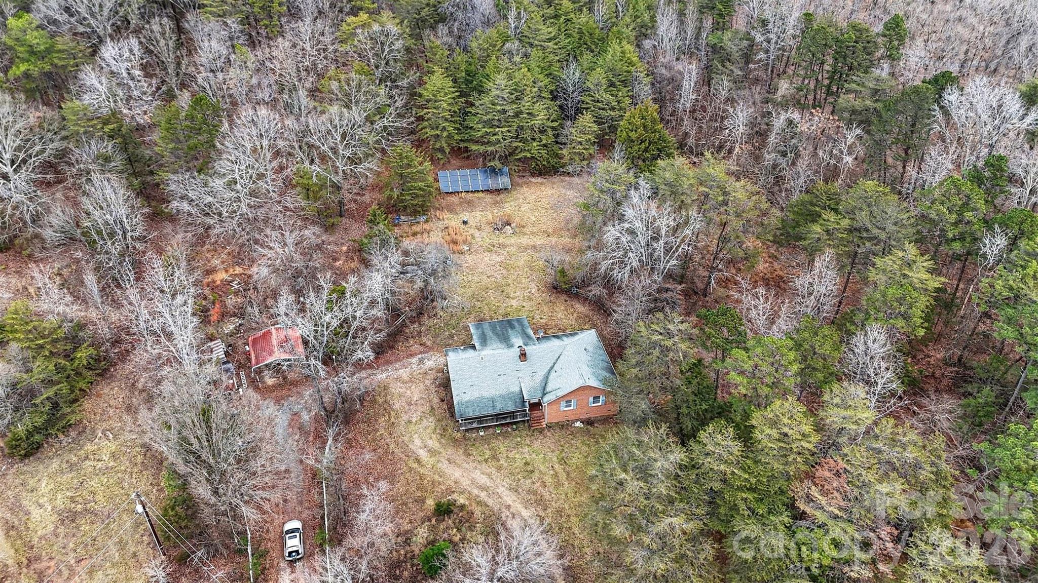 16421 Shallow Pond Road Charlotte, NC 28278 - Photo 22 of 24 a backyard of a house with lots of green space
