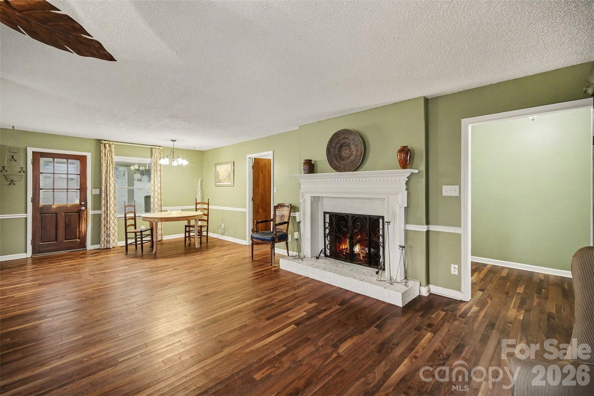 16421 Shallow Pond Road Charlotte, NC 28278 - Photo 7 of 24 a living room with furniture and a fireplace
