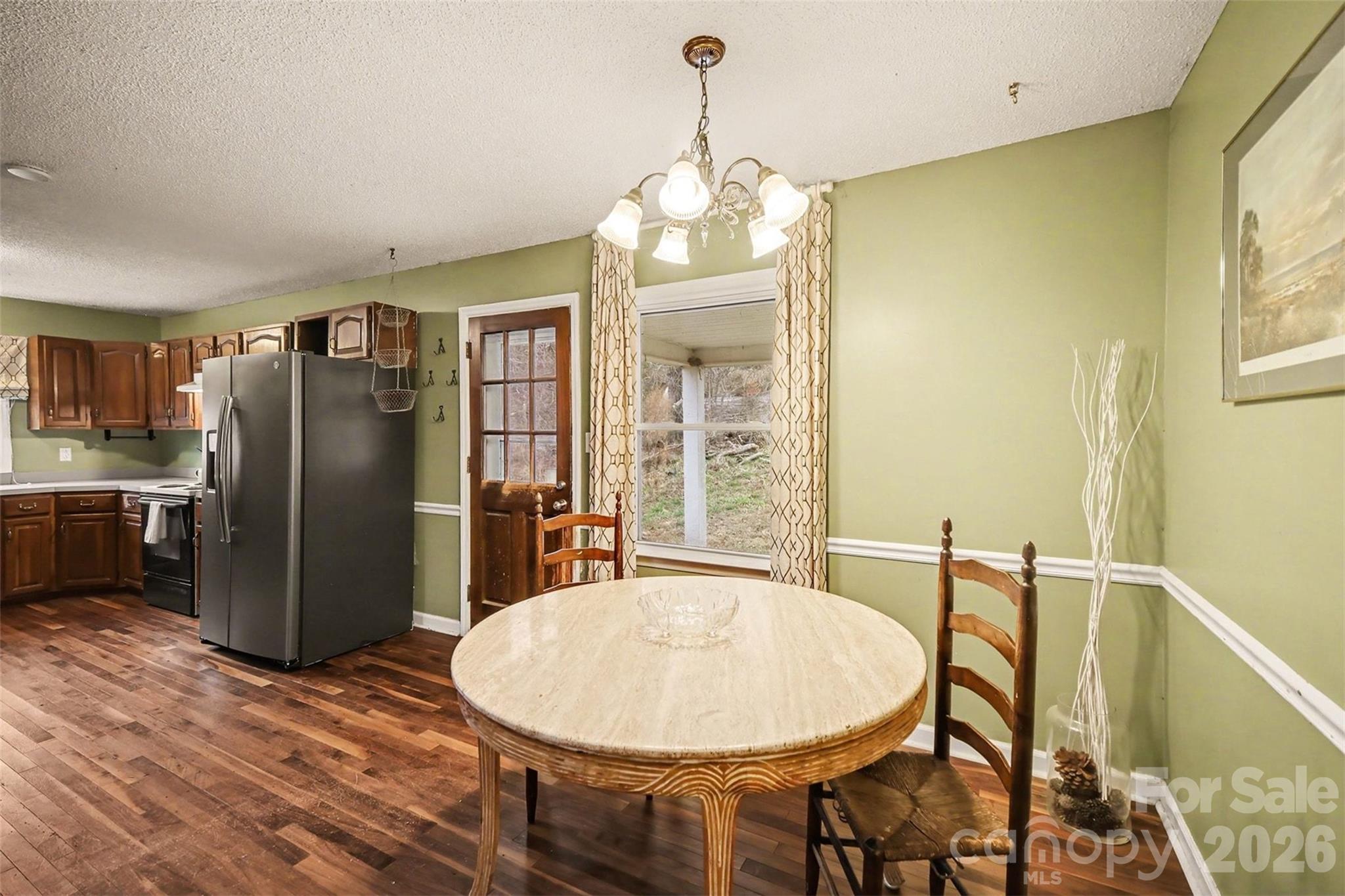 16421 Shallow Pond Road Charlotte, NC 28278 - Photo 8 of 24 a view of a dining room with furniture window and wooden floor