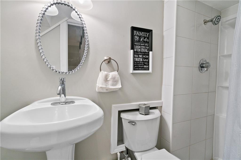 5431 Hamilton Road Gibsonia, PA 15044 - Photo 22 of 28 a bathroom with a toilet sink and mirror