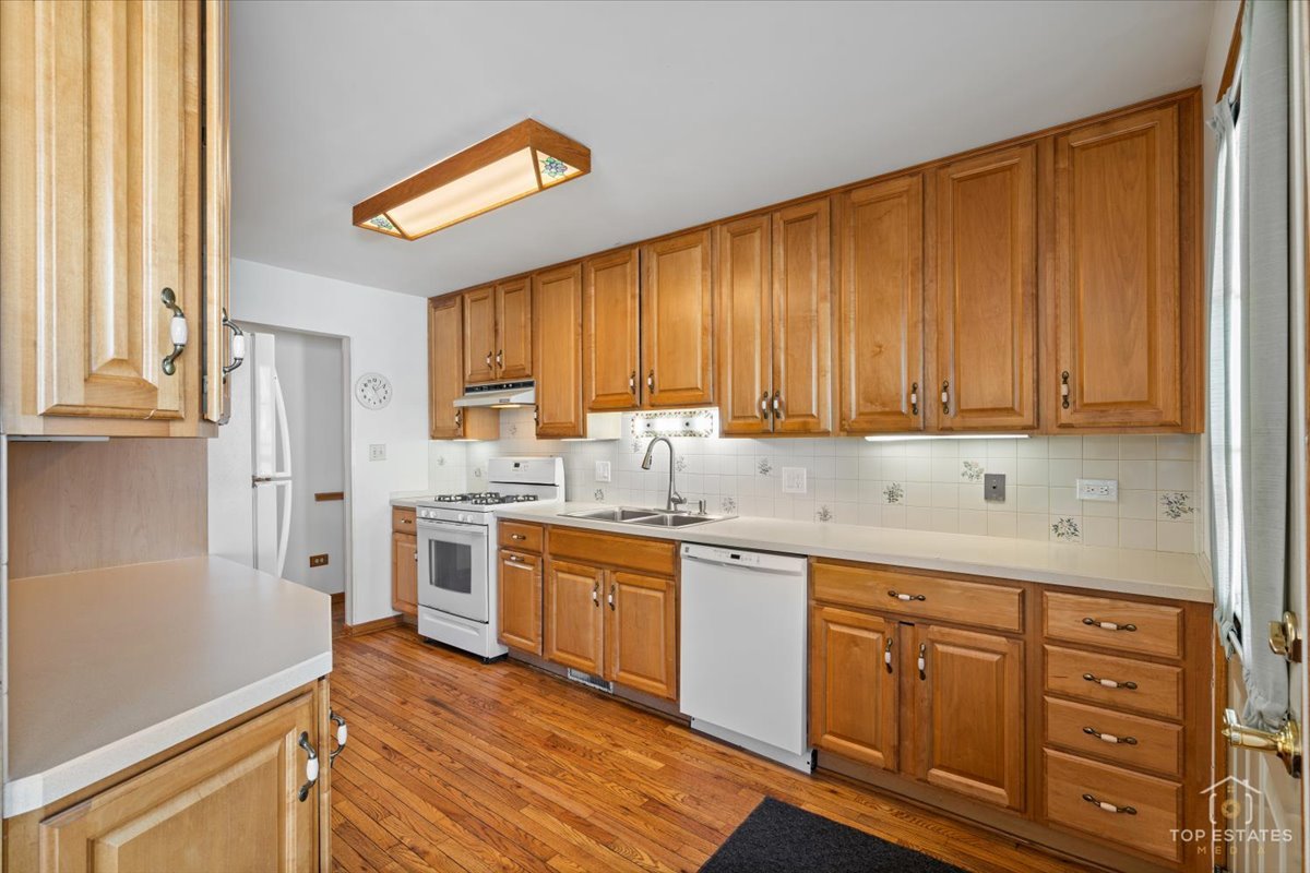 2302 Fulle Street Rolling Meadows, IL 60008 - Photo 19 of 48 a kitchen with sink cabinets and window